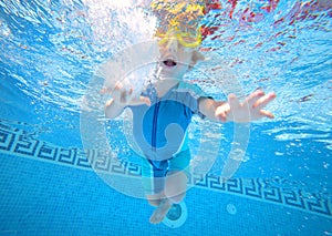 Young boy playing underwater