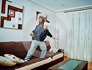 Young boy playing video games with 3d glasses