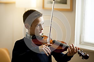 Young boy playing violin