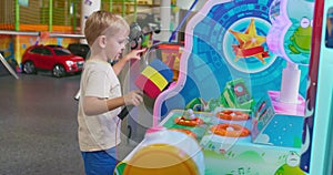 Young Boy Playing Whack-a-Mole at Arcade