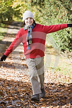 Young boy playing in woods