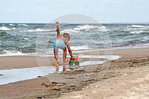 Young Boy Plays on Beach