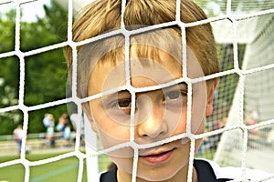 Young boy plays soccer