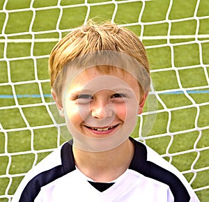 Young boy plays soccer