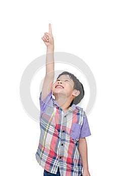 Young boy pointing up over white
