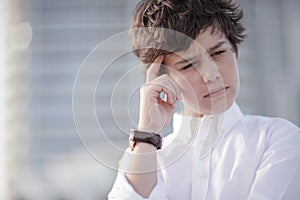 Young boy pondering