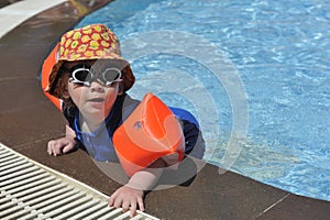 Young boy at poolside