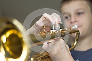 Young Boy Practiving Horn