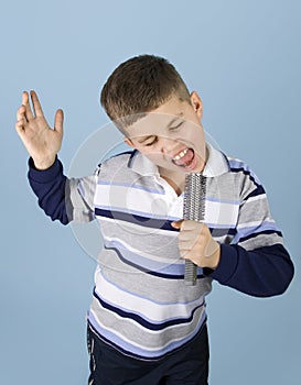 Young boy pretending rock star photo