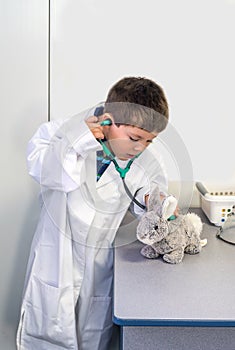 Young boy pretends to be a veterinarian