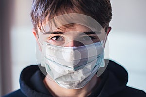 Young boy with protective mask infection fear concept - quarantine at home