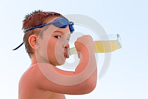 Young Boy Quenching his Thirst photo