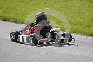 Young Boy Racing Go Kart