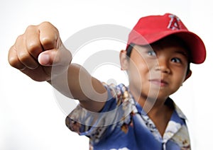 Young boy raising fist victorious