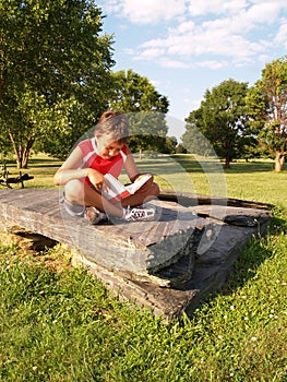 Young boy reading a book