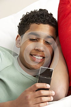 Young Boy Reading Text Message photo