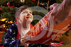 Young Boy Receiving Christmas Present