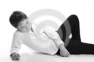 Young boy reclining on floor