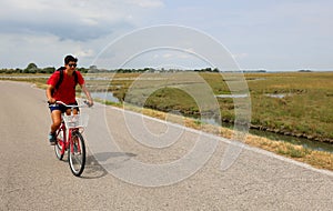 Young boy with red bike