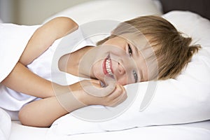 Young Boy Resting In Bed