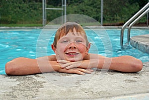 Young boy resting after swimming