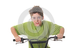 Young boy riding bicycle fast