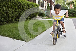 Young boy riding his bicycle