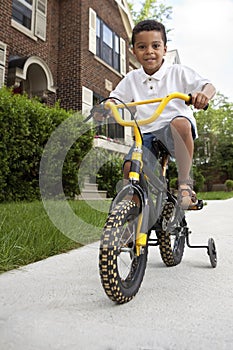 Young boy riding his bicycle