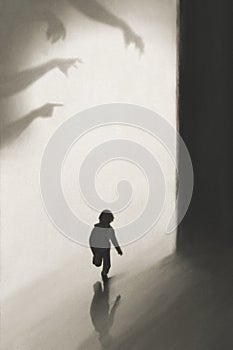 Young boy runs away frightened by shadows of hands on the wall who want to catch him