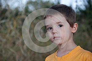 Young Boy with sad pensive expression