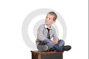 Young boy sat cross-legged