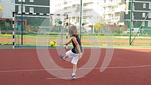 A young boy scores a goal during a penalty shoot out. slow motion. Outdoors. sport it`s source to health life.
