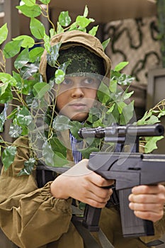 Young boy scout with rifle