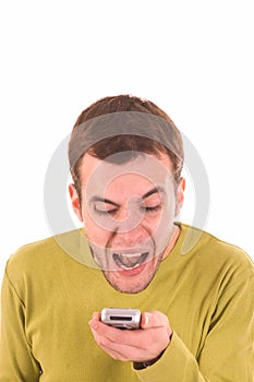 Young boy screaming on the mobile phone.