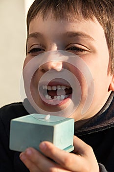 Young boy showing his first missing tooth