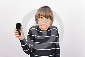 Young boy showing a simple phone is very upset