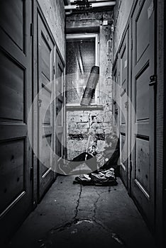 A young boy sitting alone on a floor