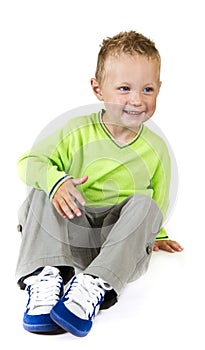 Young boy sitting - isolated