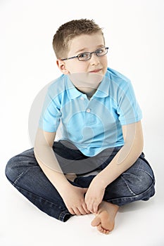 Young Boy Sitting In Studio