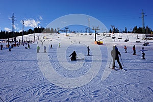 Young boy on ski lift on Bania Slope