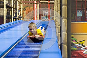 Young boy on sled slide