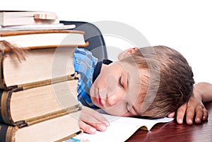 Young boy sleeping on his desk