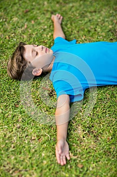 Young boy sleeping in park