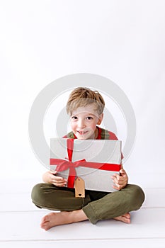 Young Boy Smiles with his Christmas Present