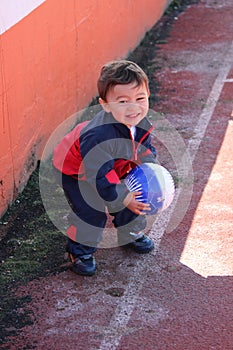 Young boy playing with soccer ball