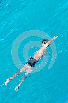 Boy swiming at red sea