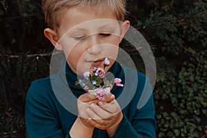 Young boy with spring flowers