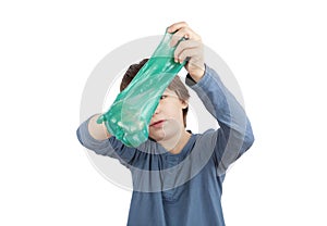 Young boy squeezing a slime.