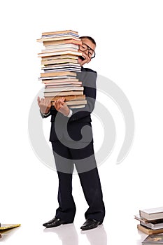 young boy with a stack of books
