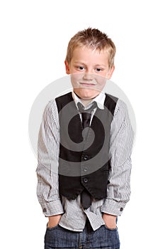 Young Boy standing with hands in pockets